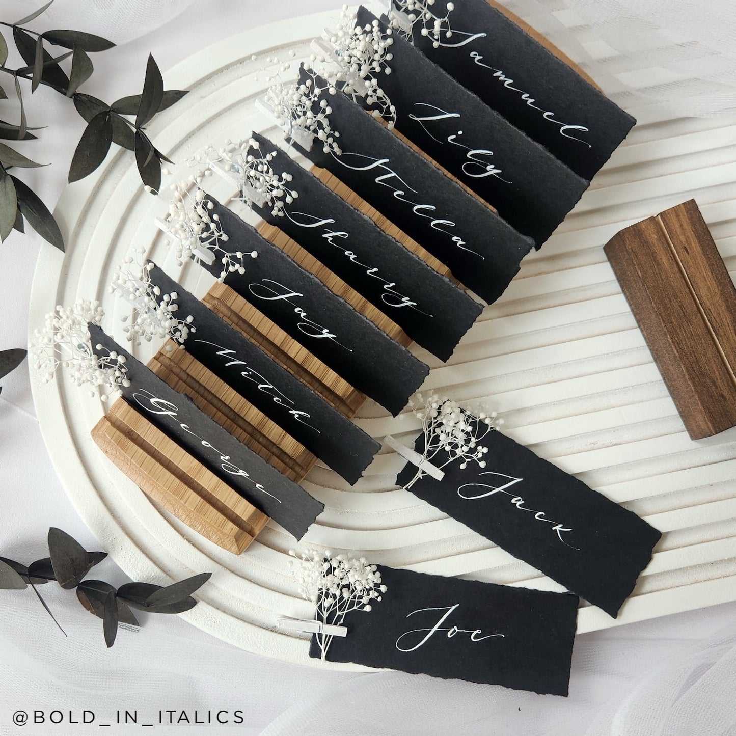 ebony wedding place cards with flowers