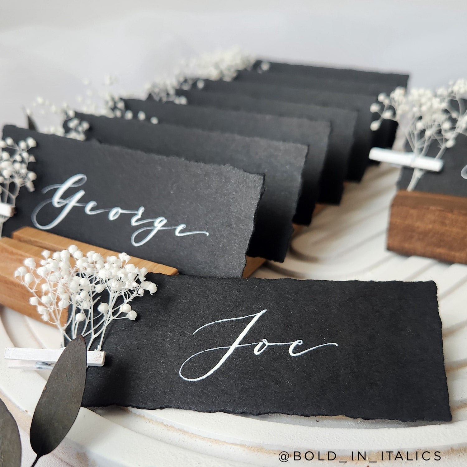 ebony wedding place cards with flowers